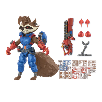 A toy action figure of Rocket Raccoon in blue and red armor with a brown tail, shown on a white background alongside interchangeable parts, a weapon, and a sheet of small accessories.