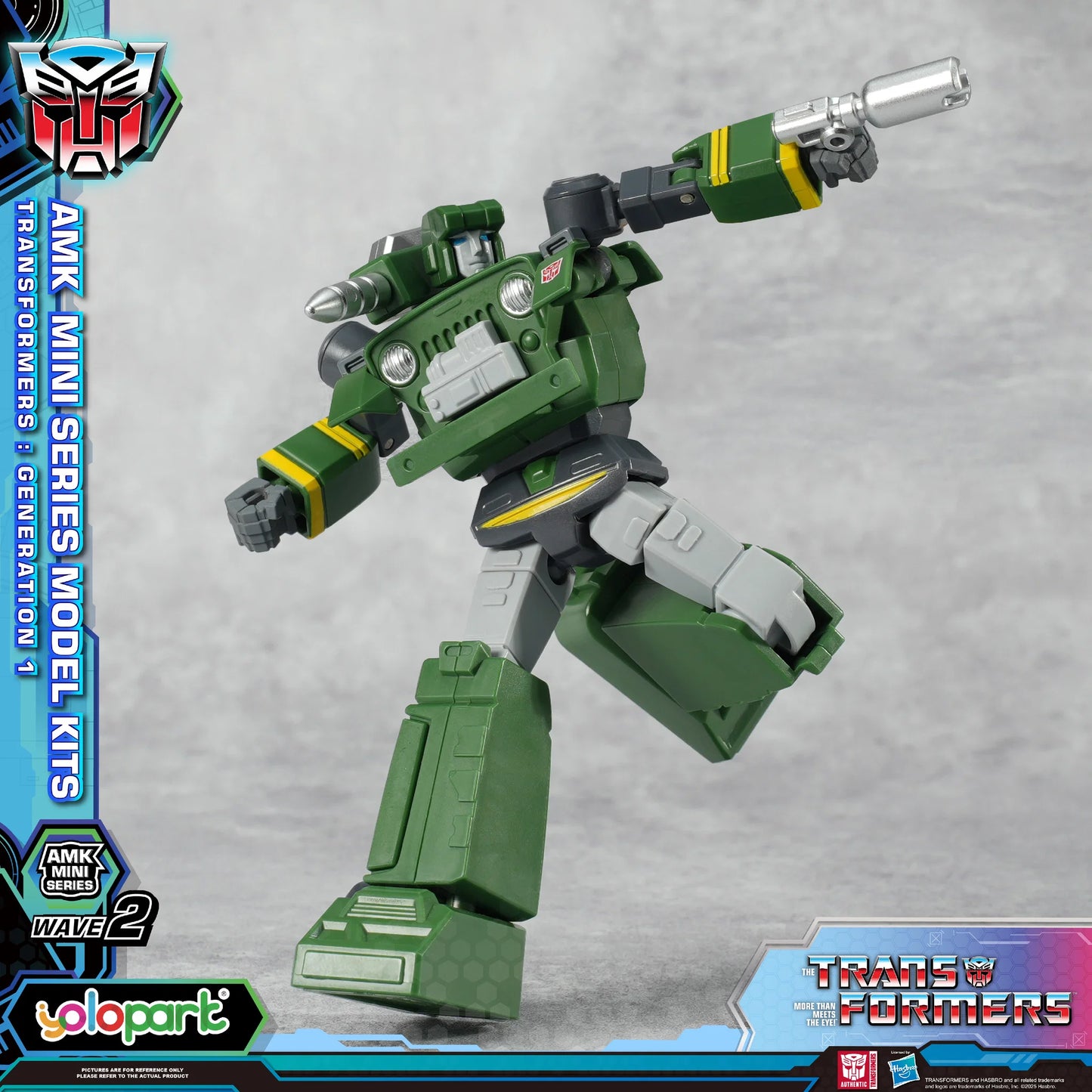 Transformers toy figure with a gun, standing on a gray background with branding elements.