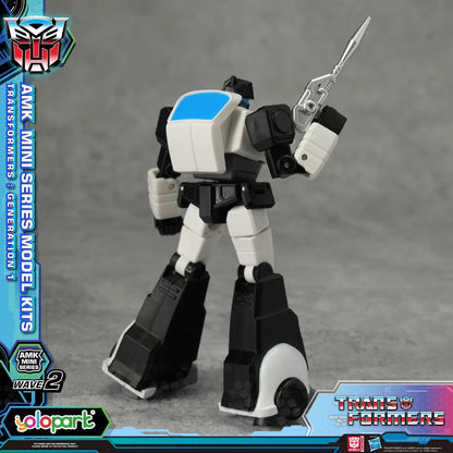 Transformers toy figure with branding and packaging elements on a gray background