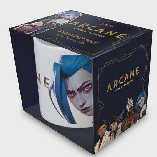 A white ceramic mug featuring an illustration of the character Arcane from League of Legends, presented inside a dark navy blue branded gift box with gold lettering.