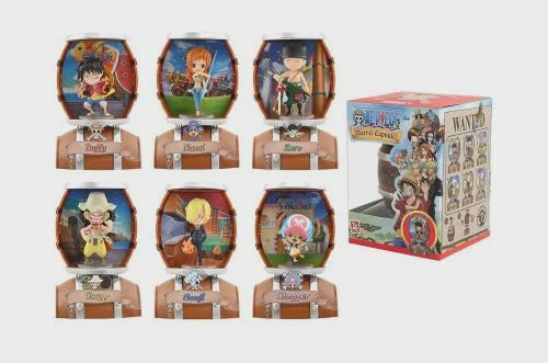 Set of figurines in display cases with a box in the background