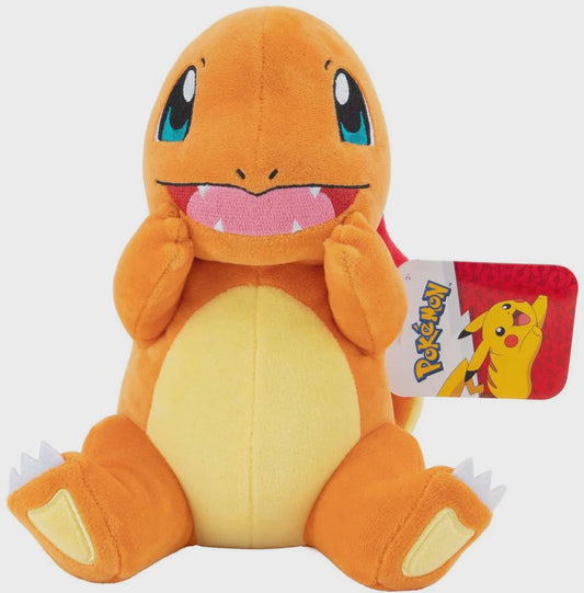 Plush toy of Charmander from Pokémon with a visible tag on a white background