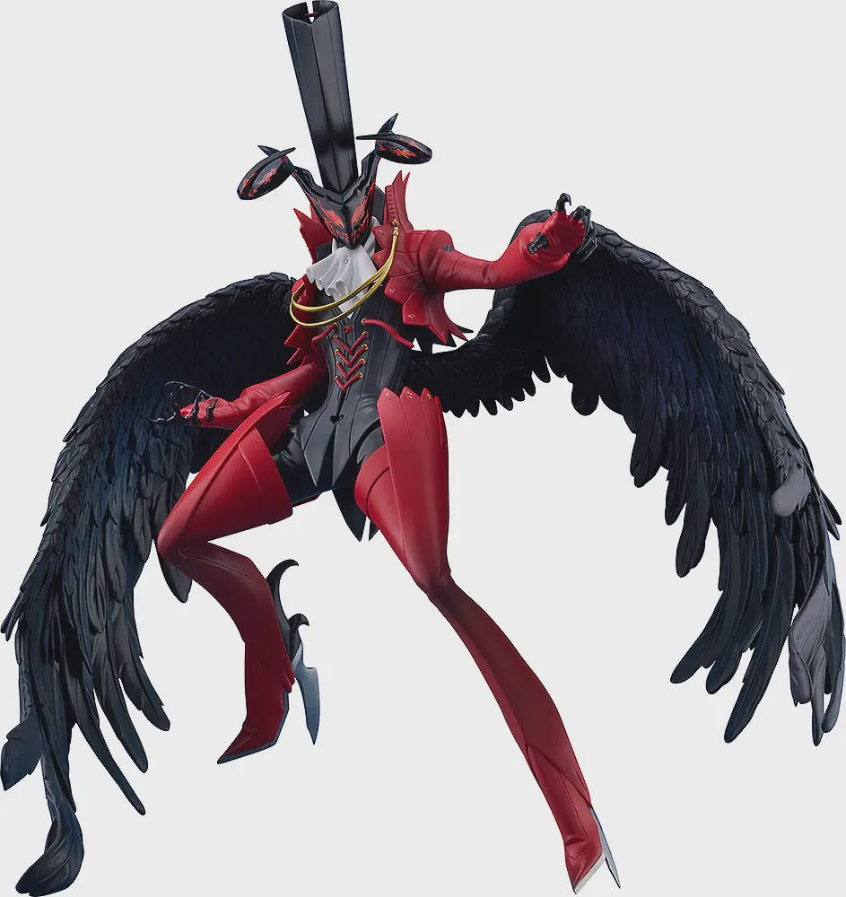 Red and black angelic or demonic creature figurine with large wings on a white background