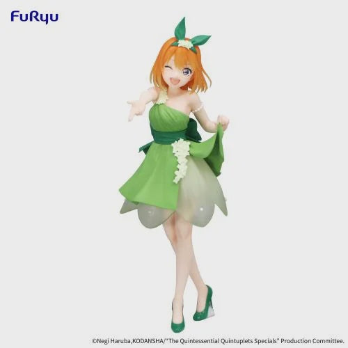 Anime character figurine in a green dress with a white background