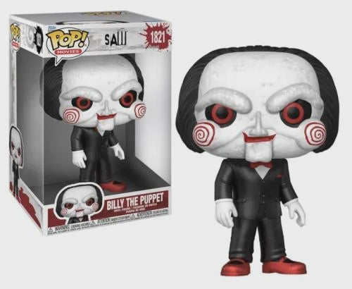 Funko Pop! vinyl figure of Billy the Puppet from the movie 'Saw' next to its packaging.
