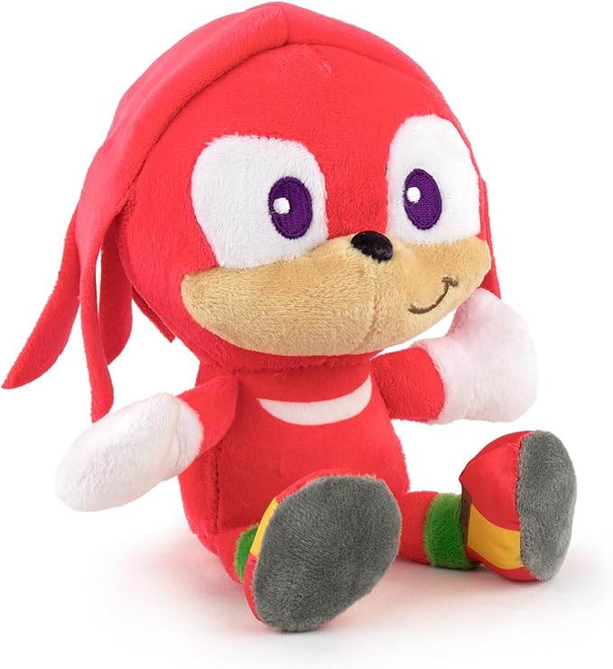 Red plush toy with a happy expression on a white background