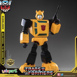 AMK Series 16 Cam Model LTP Transformers Bumble toy figure, featuring a yellow and black color scheme with the Autobot emblem on the chest, set against a dark gray background with promotional graphics.