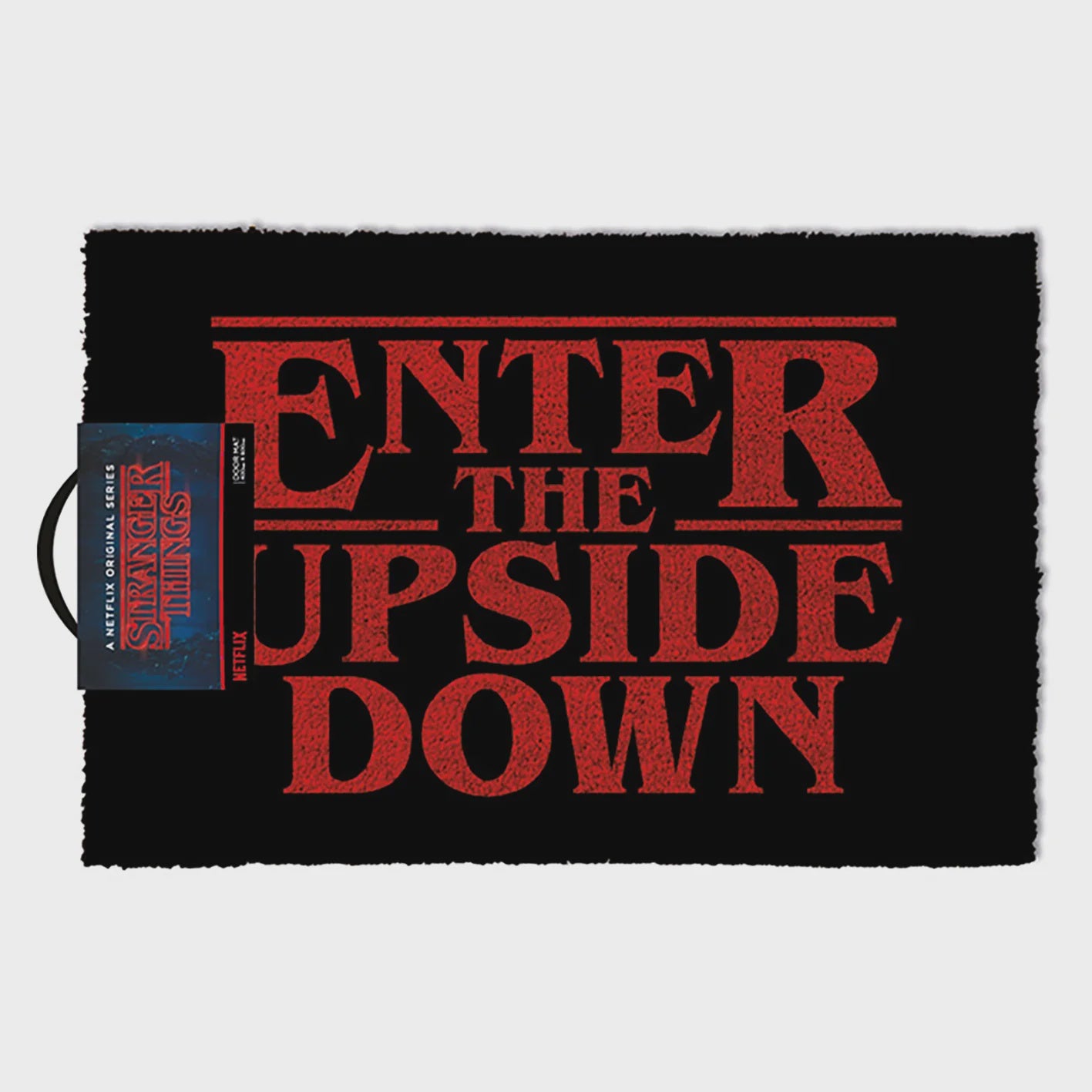 Doormat with 'Enter the Upside Down' text in red on a black background, featuring the Stranger Things logo.
