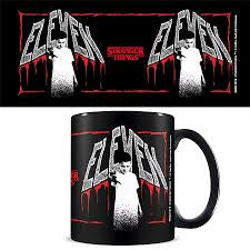 Black mug with 'Eleven' graphic design on a white background
