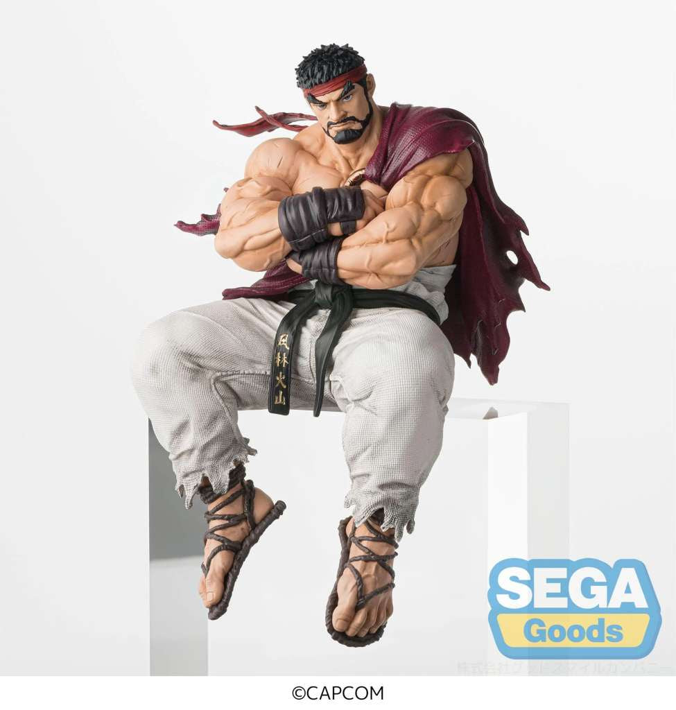 Action figure of a character from a popular video game series, sitting on a block with Sega Goods branding.