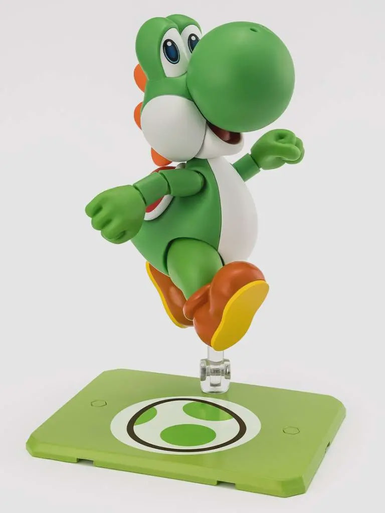 Green toy figure on a white background