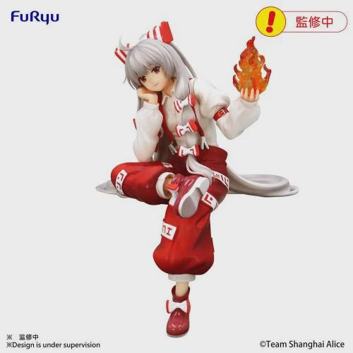 Anime character figurine in red and white outfit with a flame-like object, on a white background.