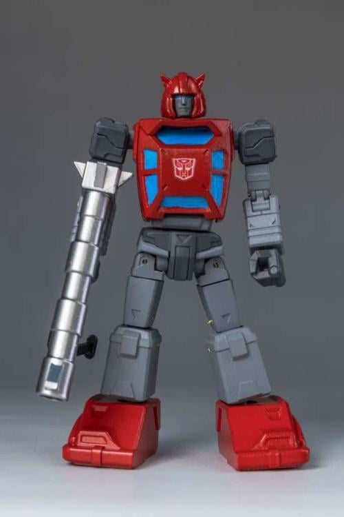 Toy robot figure with red, gray, and blue color scheme on a gray background