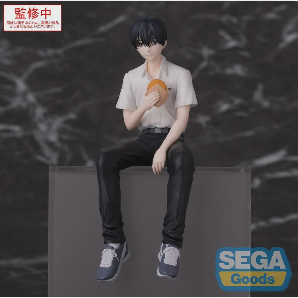 Figure of a person sitting on a block with a blurred background and Sega Goods logo.