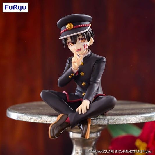Figurine of a character in a school uniform with a blurred background