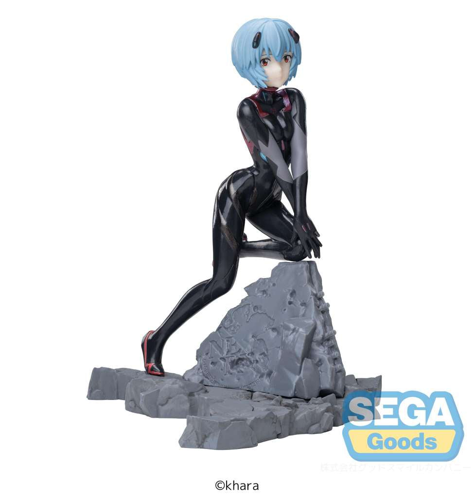 A figurine of Rei Ayanami from Evangelion, sitting on a rock-like base, wearing her iconic black and purple outfit with blue hair.